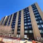 An apartment building against a blue sky