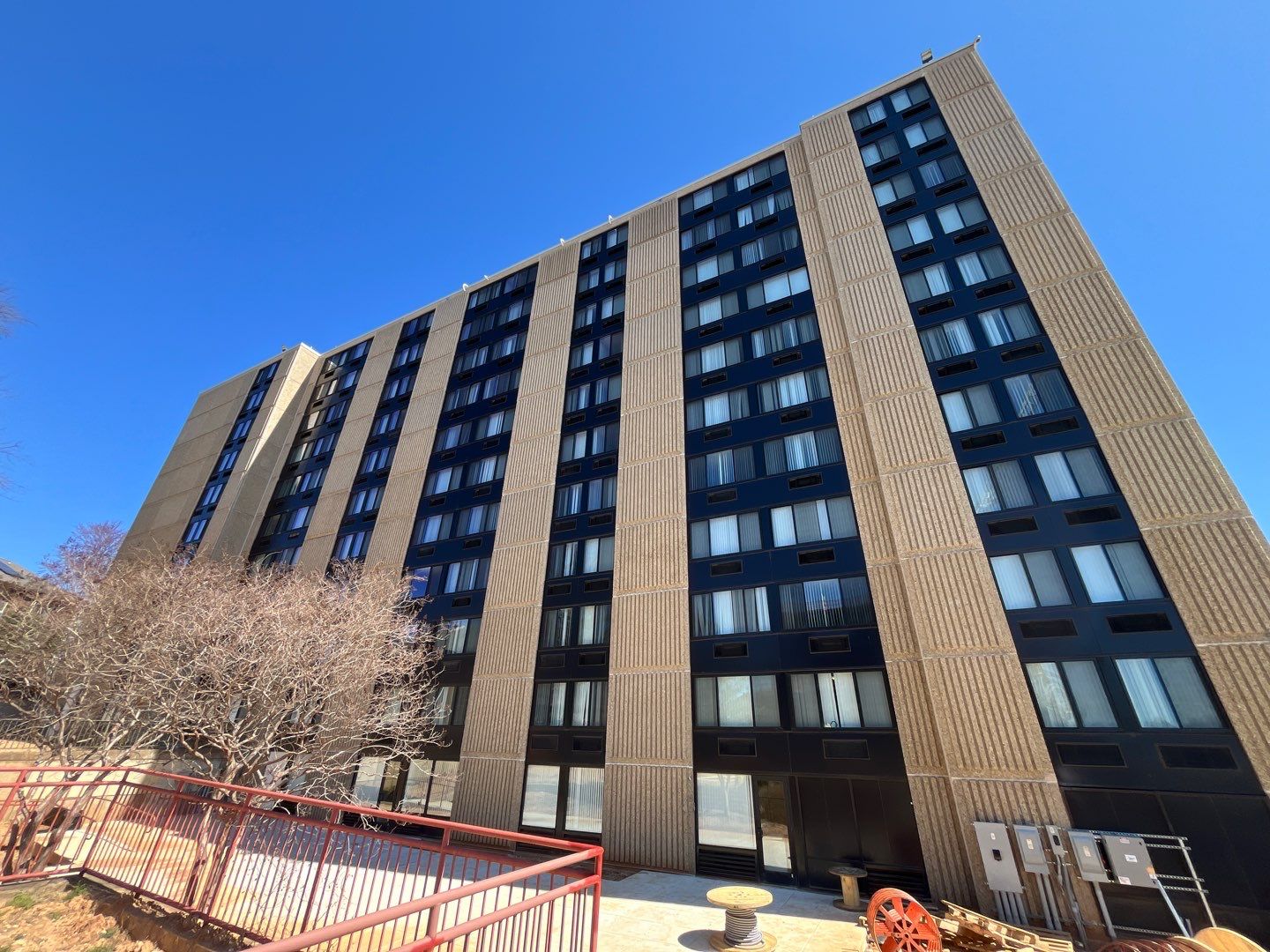 An apartment building against a blue sky
